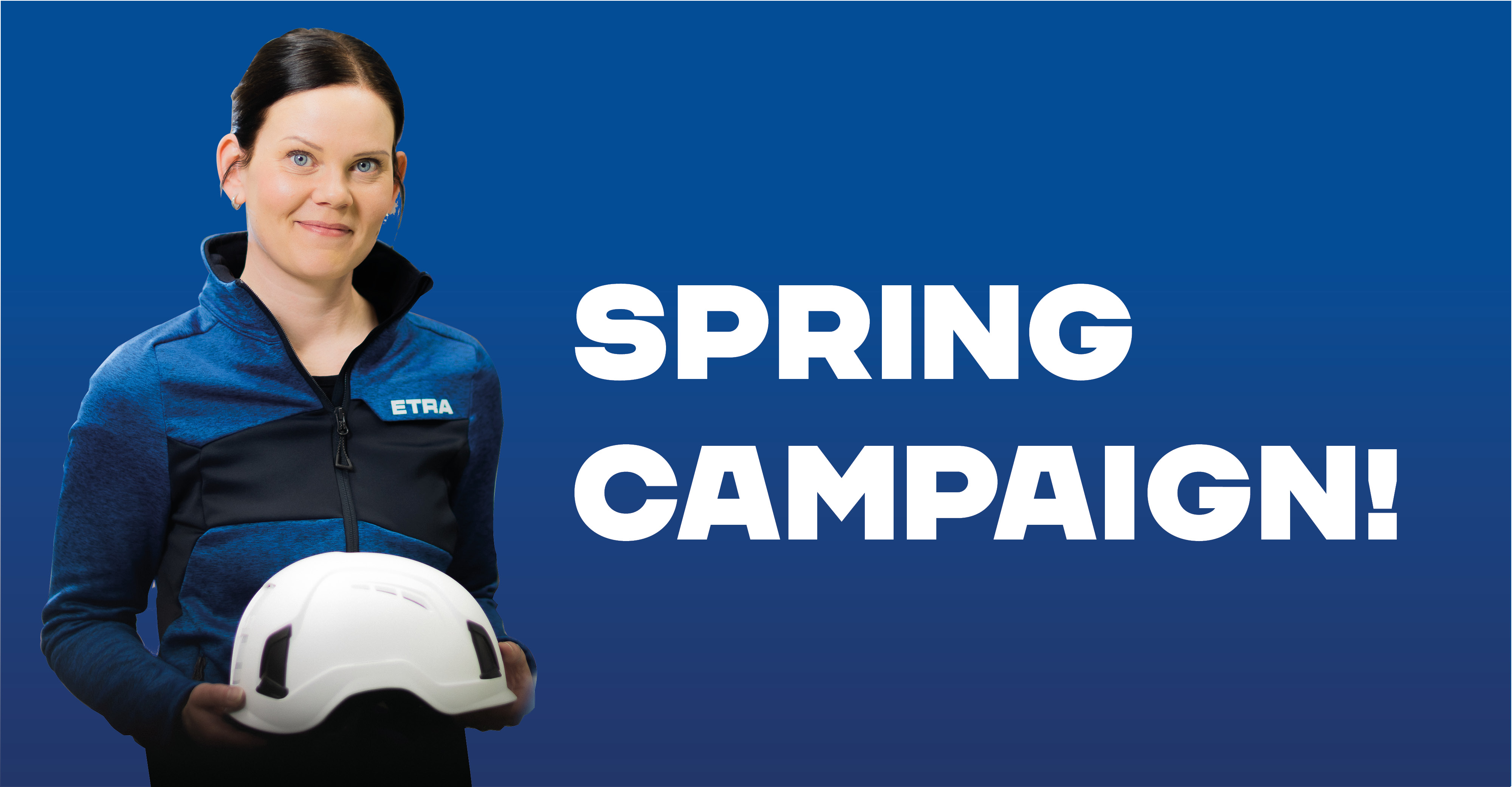Promotional image featuring a woman smiling against a blue background, holding a white safety helmet. She is wearing a blue and black jacket with the Etra logo.